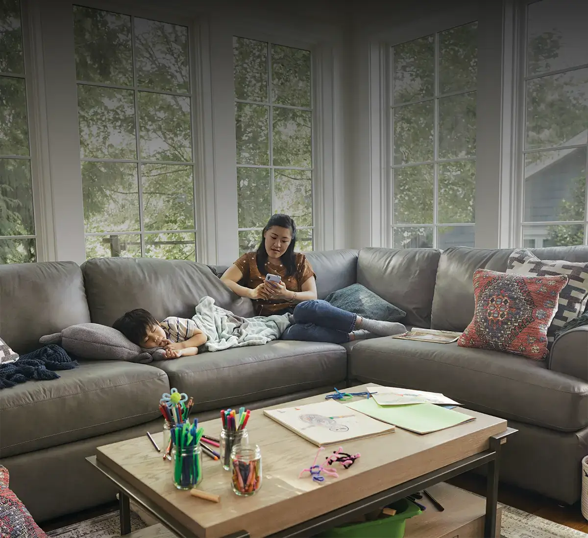 Mother and son relaxing in a La-z-boy sofa